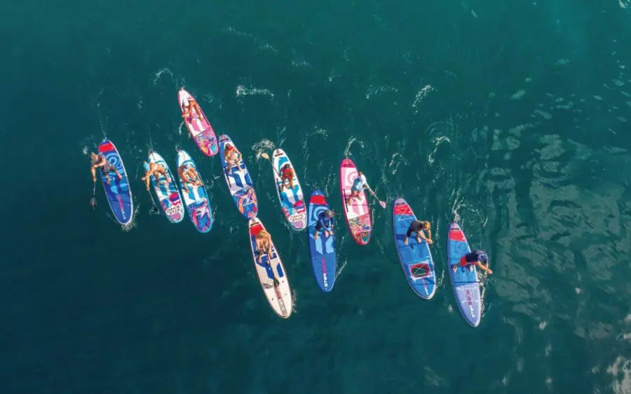 Colorful EVA stand-up paddleboard with red seats for first-time SUP buyers