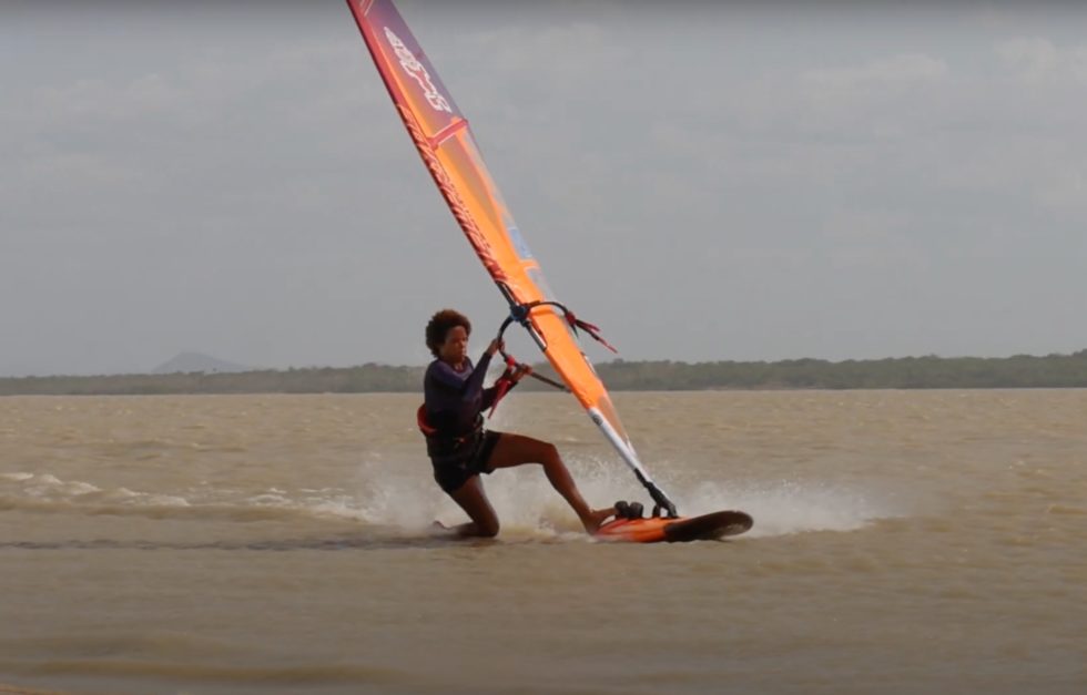 Orange windsurfing sail in black-white design for body dragging with Sarah-Quita