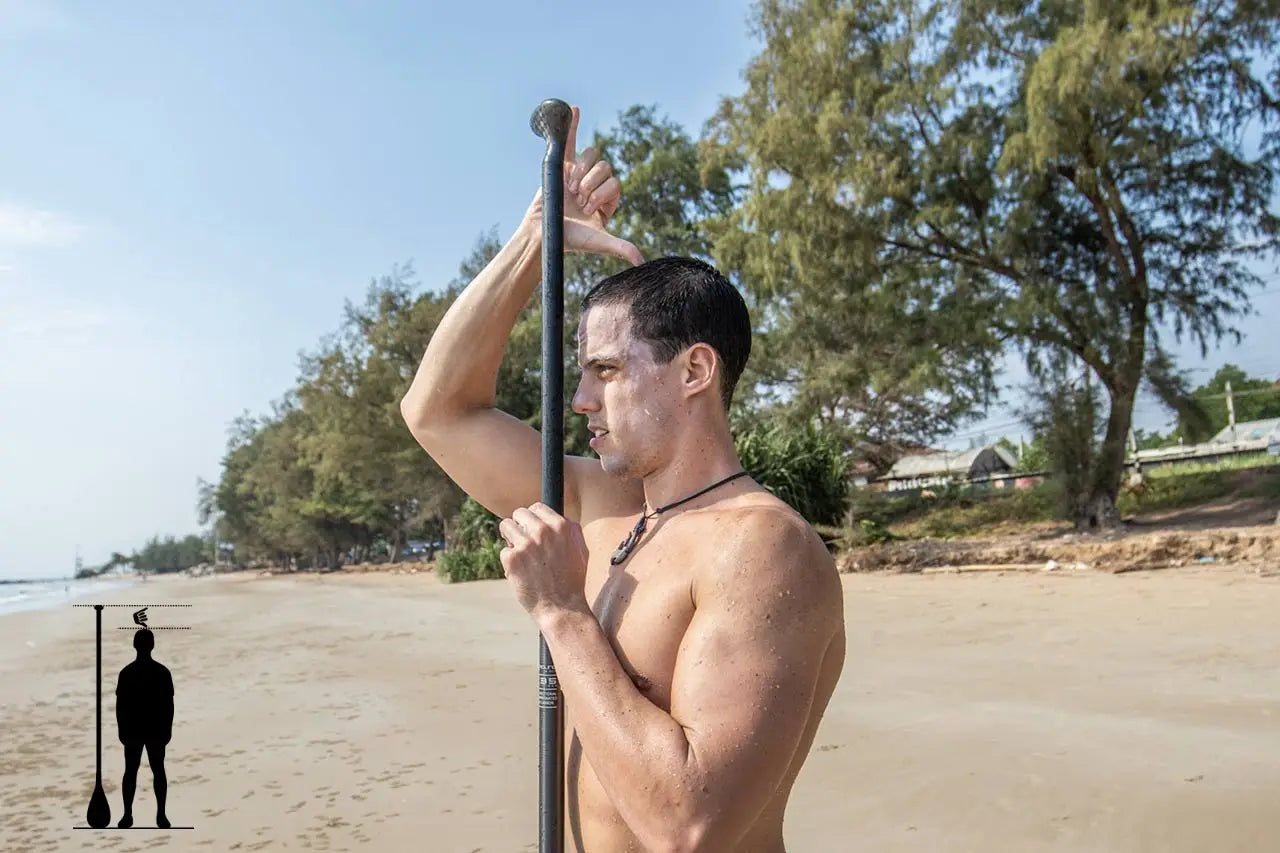Black SUP paddle with white grip tape and red leash for stand-up paddling