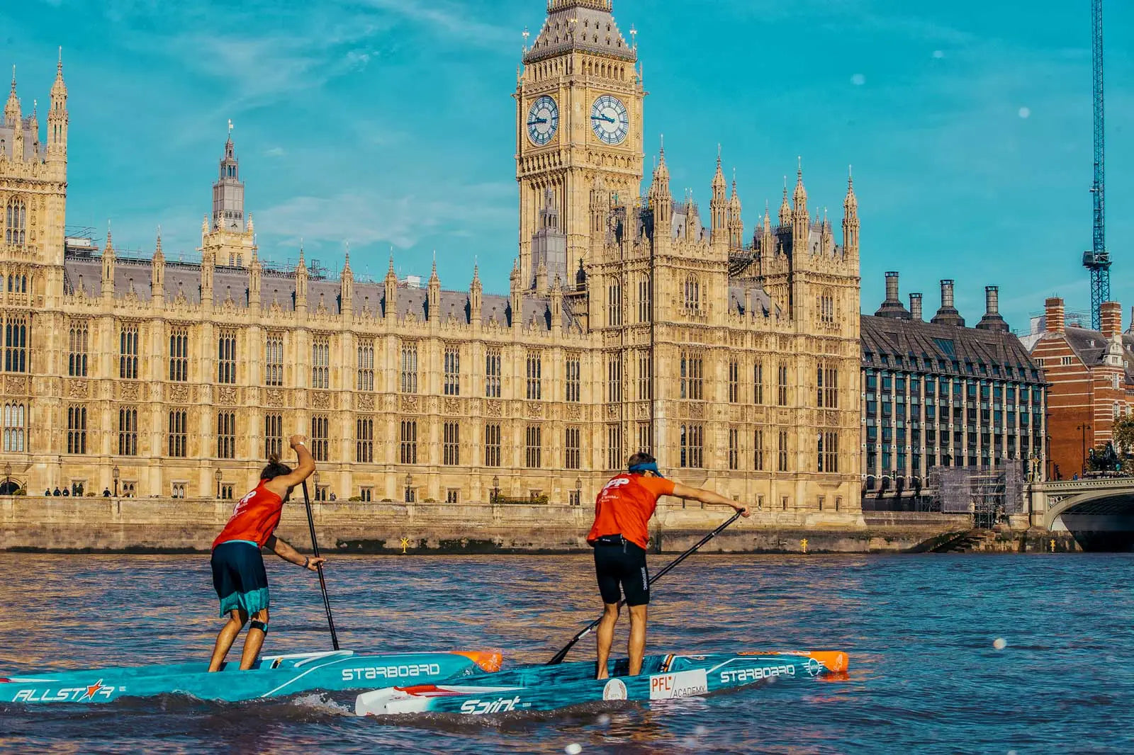 Blue and white SUP paddleboard with red accents at London SUP Open