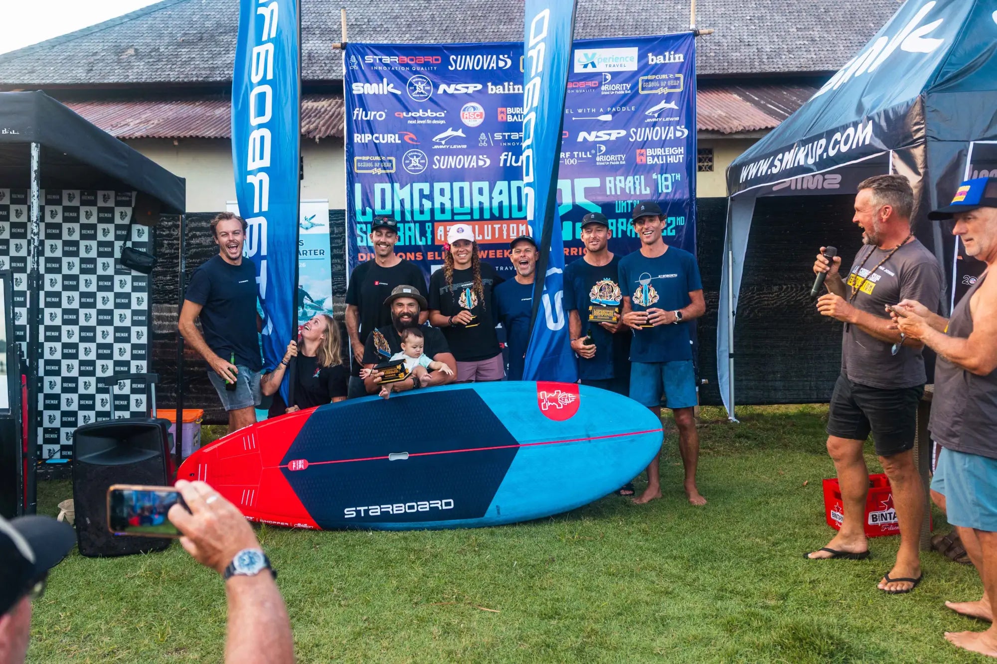 Starboard blue and red longboard surfboard with stepsurf text, 2025 LSR Bali winner