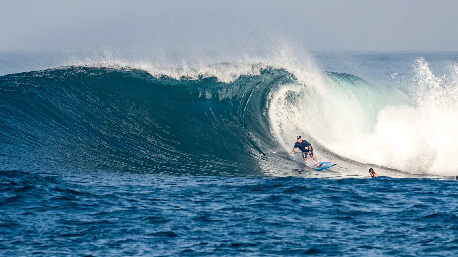 Starboard Spice surfboard with blue and white fiberglass design