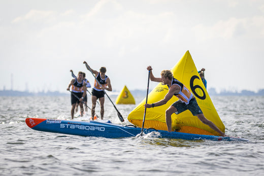 Yellow inflatable sailboat numbered 6 for Starboard Race Board rental