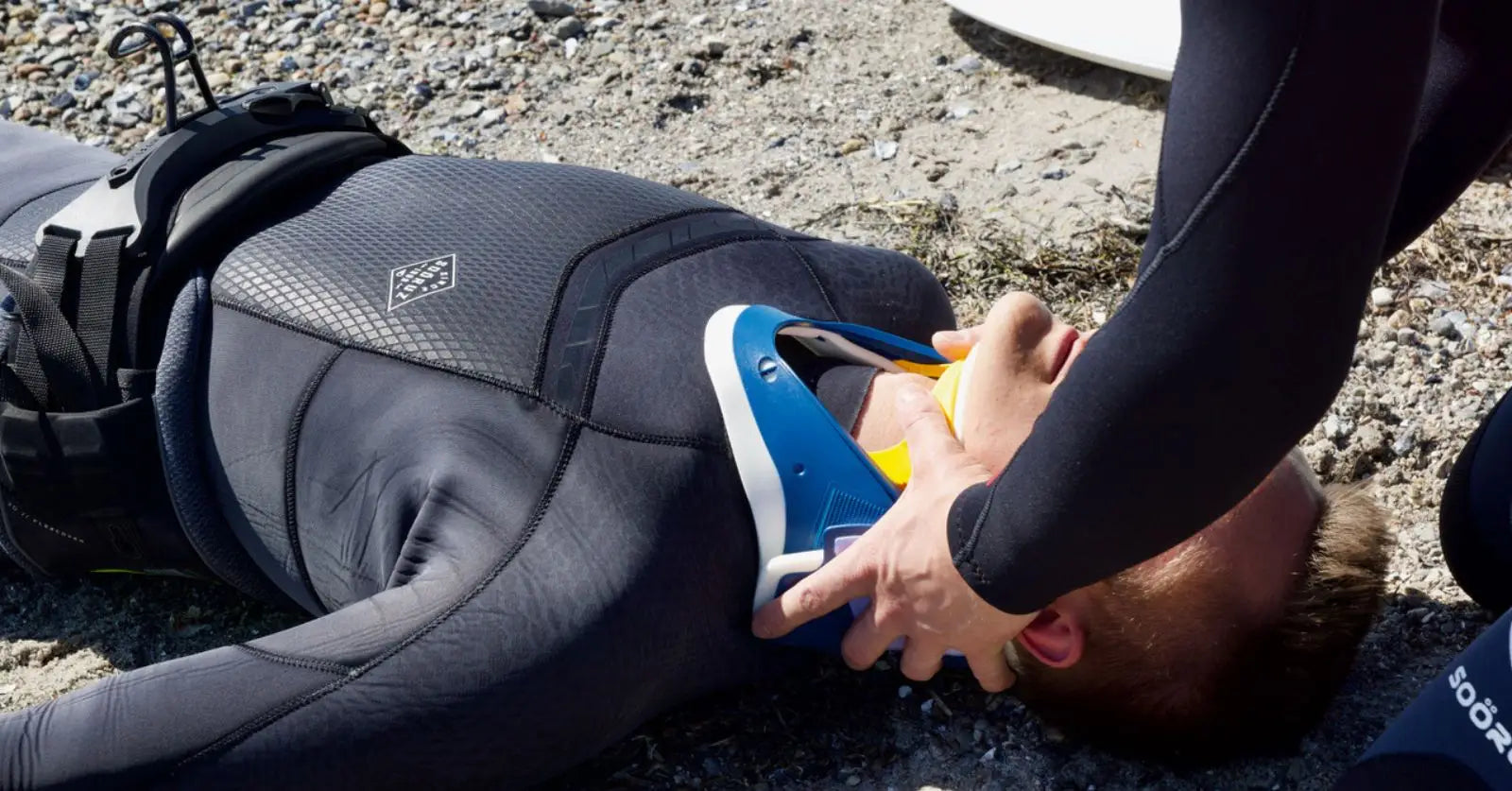 Yellow black rescue tube with blue accents for windsurfing safety study